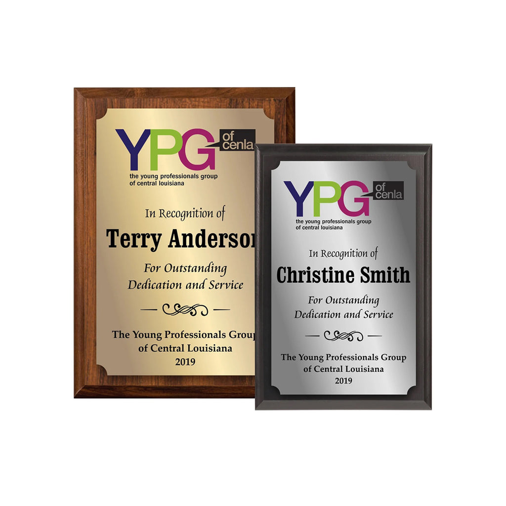 Two framed awards for Terry Anderson and Christine Smith from YPG of Central Louisiana